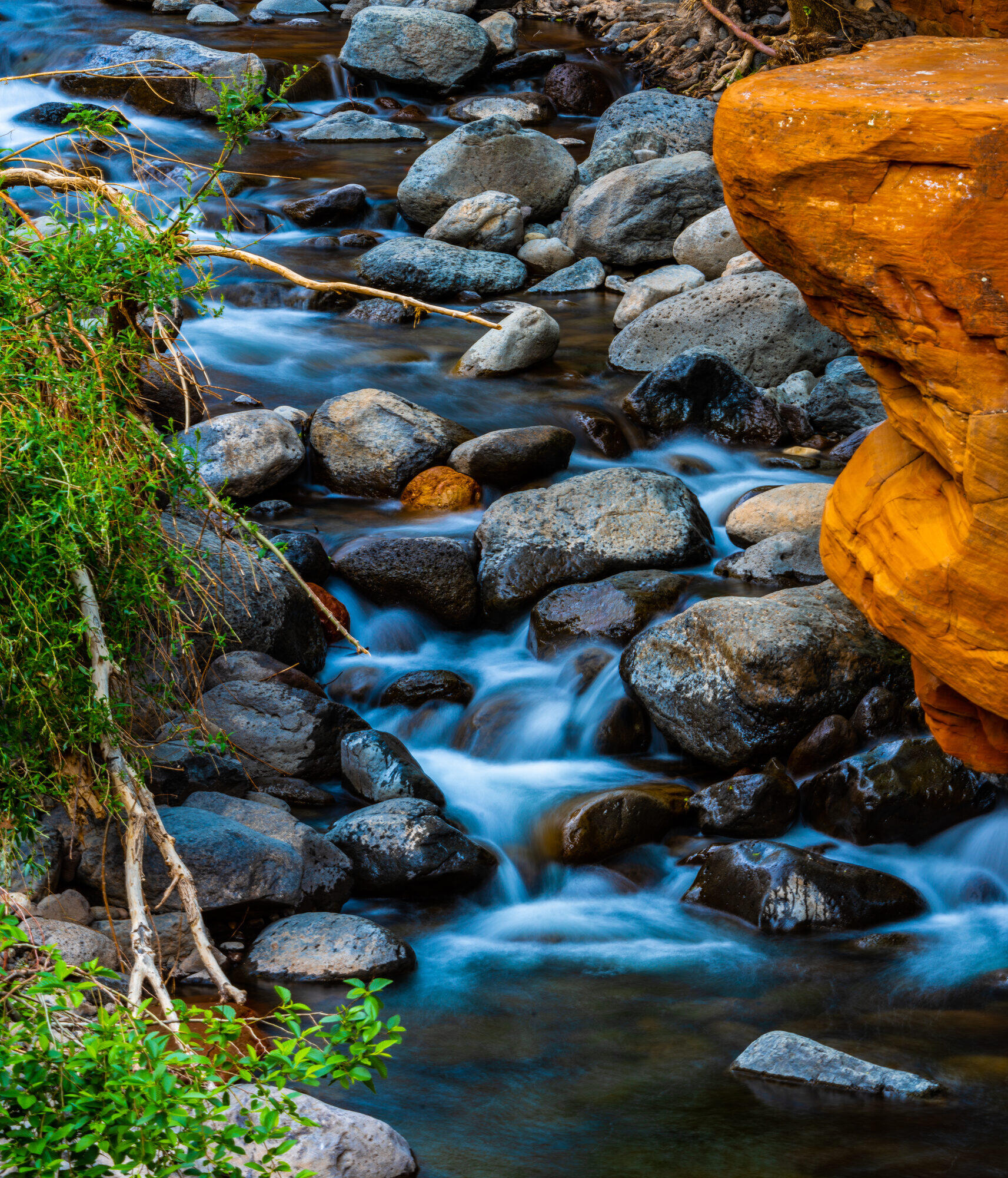 Clear stream running over river rocks